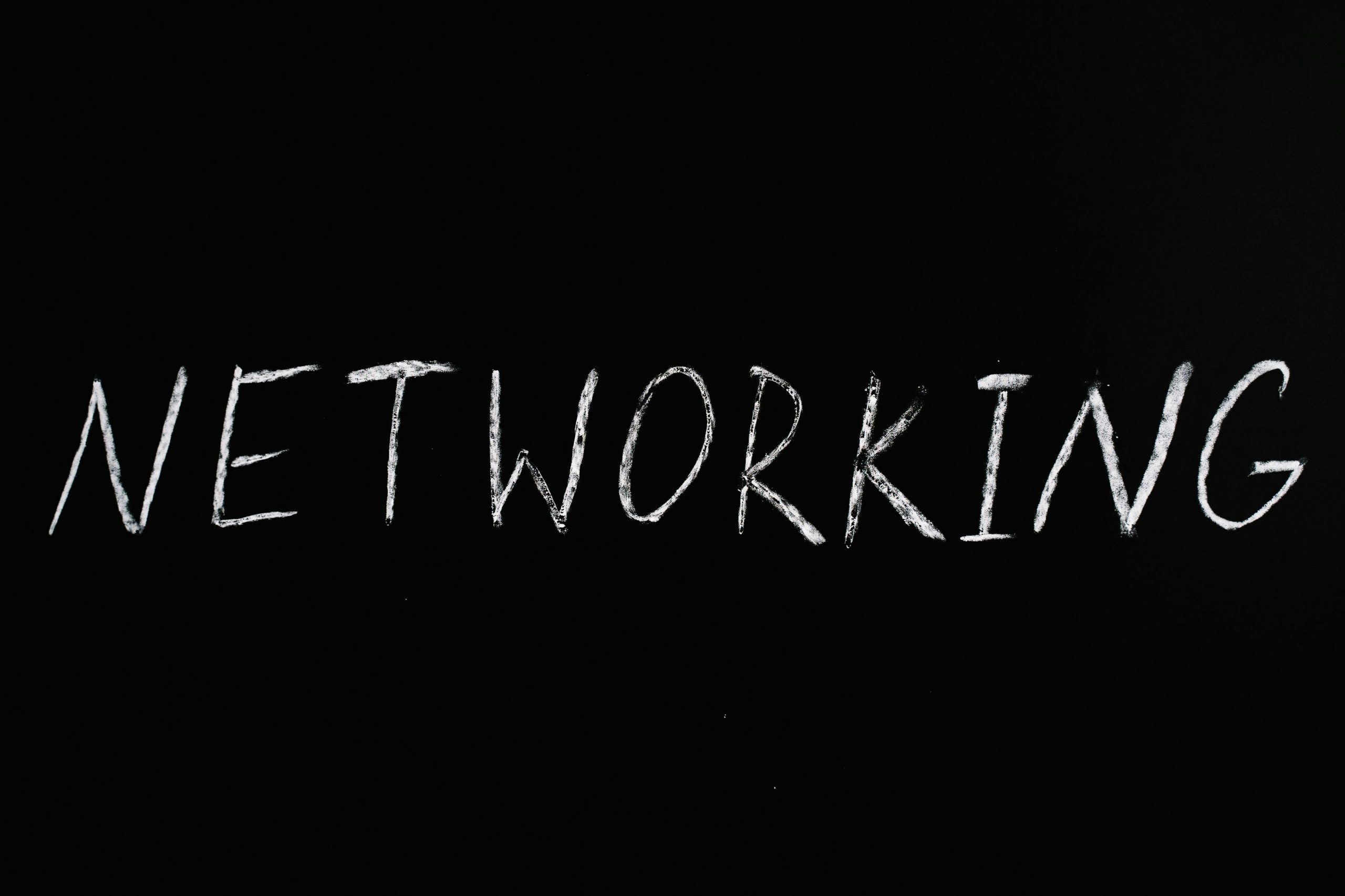 Handwritten 'Networking' text on a chalkboard styled black background, symbolizing communication.